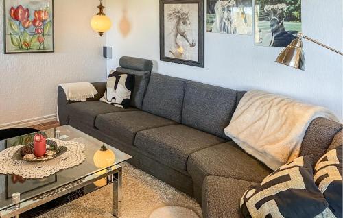 a living room with a couch and a table at Beautiful Home In Söderköping With Wifi in Söderköping