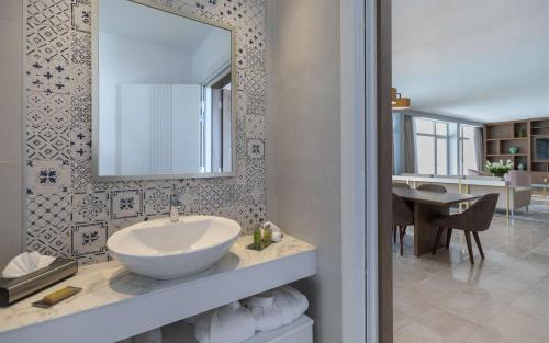 a bathroom with a sink and a mirror at Hilton Skanes Monastir Beach Resort in Monastir