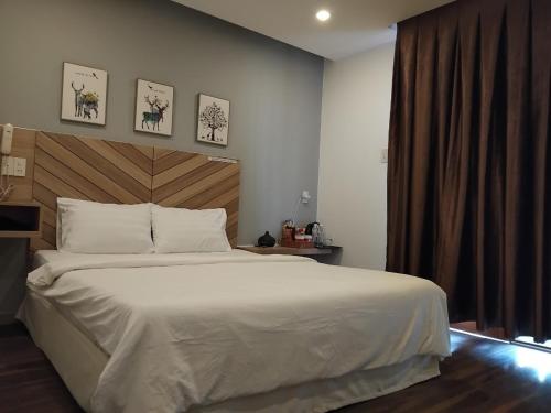 Кровать или кровати в номере Vindy House