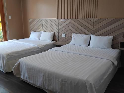 Кровать или кровати в номере Vindy House