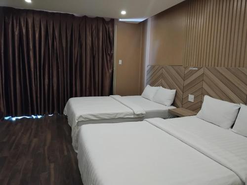 Кровать или кровати в номере Vindy House