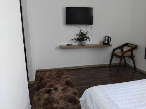 Телевизор и/или развлекательный центр в Vindy House