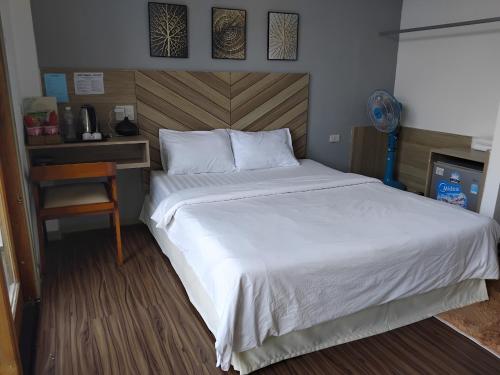 Кровать или кровати в номере Vindy House