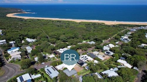 an aerial view of a house with the rbn logo at A Grand Beach Retreat in Killcare