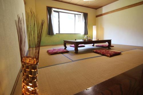 a meditation room with a table and some pillows at TRAX NUNOBA - Vacation STAY 02612v in Yuzawa