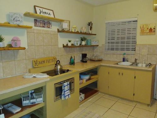 a kitchen with a sink and a counter top at The sweet Oasis 1 bedroom Apartment in Nassau