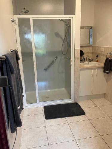 a shower with a glass door in a bathroom at Eagle Bay Views in Eagle Point