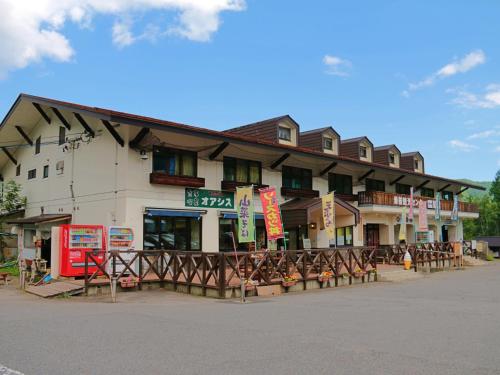 a building with a lot of tables in front of it at 雀の宿 やぐら in Matsumoto