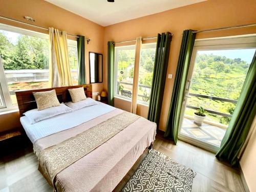 a bedroom with a large bed and large windows at Moonlight Chillers By LexStays in Yedapalli