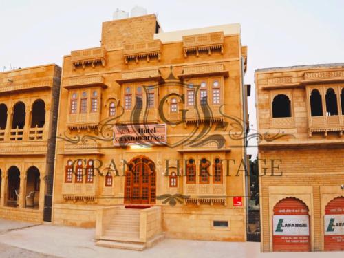 a building with a sign on the side of it at Hotel Grand Heritage Jaisalmer in Jaisalmer
