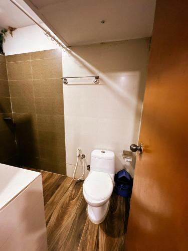 a bathroom with a toilet and a shower at Riverdale Homestay Kumarakom by LexStays in Kumarakom