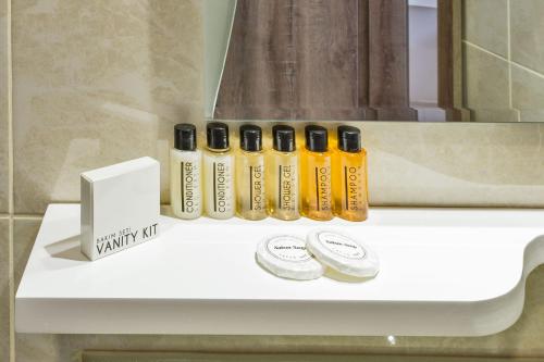 a white table with a group of bottles on it at Alphonse Hotel in Istanbul