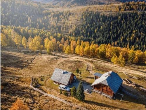 an aerial view of a house in a field at Almhütte auf der Laußnitz Alm - Auszeit in schöner Bergidylle auf 1836m in Rennweg