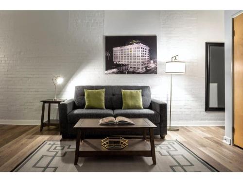a living room with a couch and a coffee table at Beautiful 2BR 2BA In The Block by CozySuites in Indianapolis