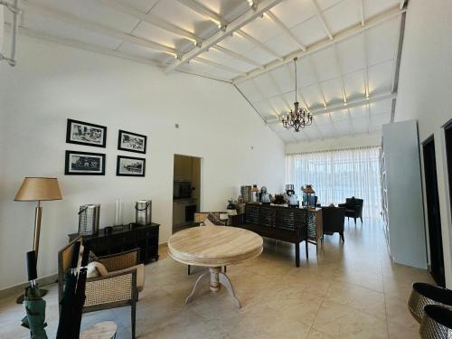 a living room with a table and a dining room at The Niche Hikkaduwa - 10 minutes to the beach in Hikkaduwa