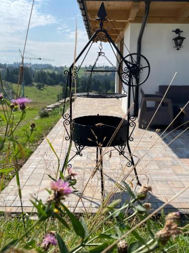 a swing on the patio of a house at Zagroda Rusiński in Bukowina Tatrzańska
