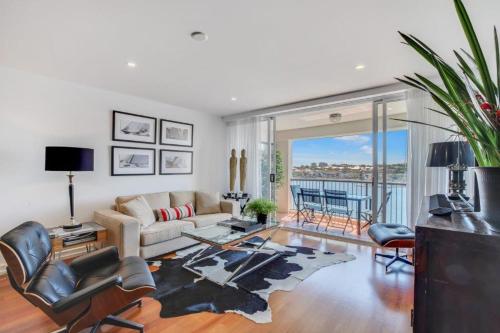 a living room with a couch and a table at Goldsborough Place Apartments in Brisbane