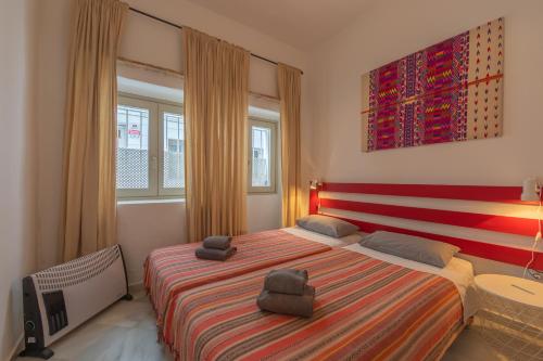 Ένα ή περισσότερα κρεβάτια σε δωμάτιο στο The Surfers Nest