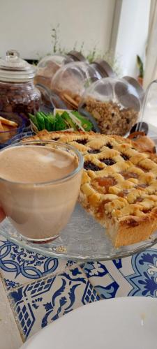 a plate of food with a pie and a bowl of dip at TRANI LA GRAZIA b&b in Trani