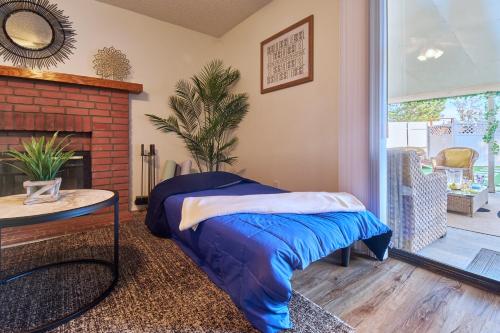 a living room with a bed and a fireplace at Entire Mountain Oasis Home in Hemet