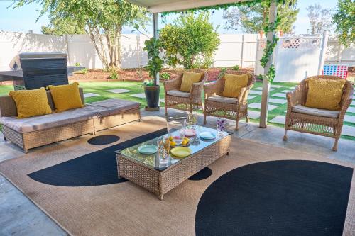 a patio with a couch and chairs and a table at Entire Mountain Oasis Home in Hemet