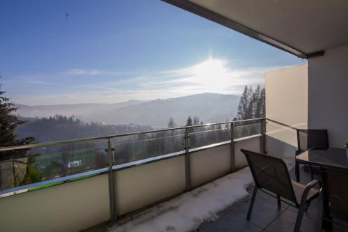 a balcony with a view of the mountains at Apartview Bukowa Apartments by Rent like home in Wisła