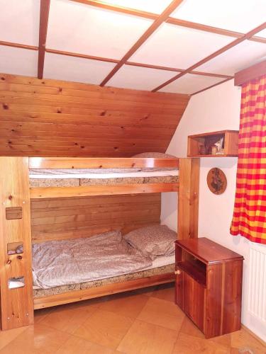 a bedroom with two bunk beds in a room at Jirkova chata in Lipova Lazne