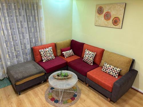 a living room with a couch and a table at Sea and Pinewood Ofir Apartment in Fão