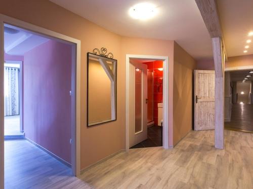 a hallway with a mirror on the wall at Penzion Na Palubě in Jeseník