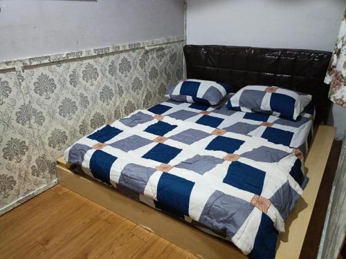 เตียงในห้องที่ Homestay Bemban Batu Gajah