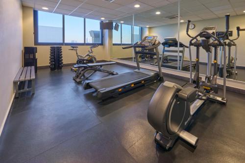a gym with several treadmills and cardio machines at City Express Plus by Marriott Ciudad de México Patio Universidad in Mexico City
