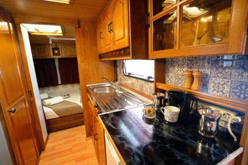 a kitchen with a sink and a counter top at Lemon Garden Camper in Chania Town
