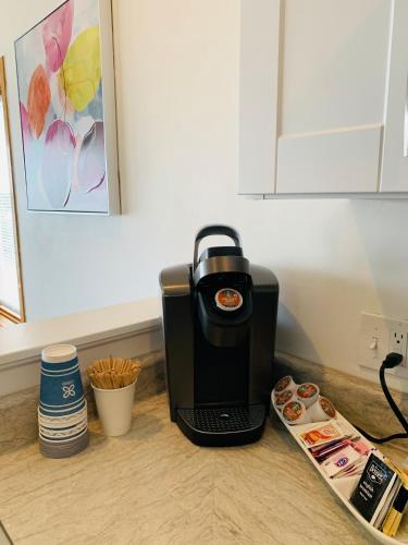 a coffee maker sitting on top of a counter at The best lake view in Ozark. in Lake Ozark