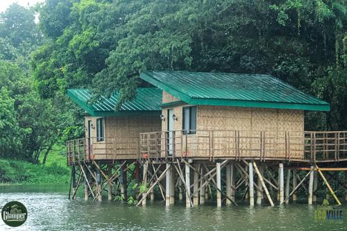 a house on a pier in the water at Caliraya Ecoville Recreation and Farm Resort in Cavinti