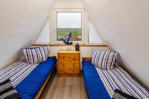 Ένα ή περισσότερα κρεβάτια σε δωμάτιο στο Ferienhaus Schmidt