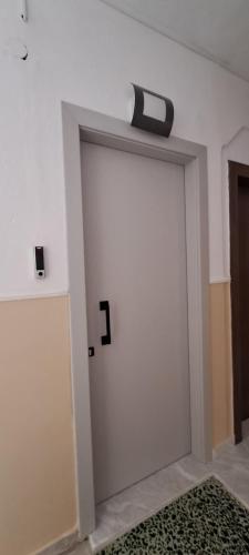 a sliding door with a clock on top of it at Lago Suite in Kastoria