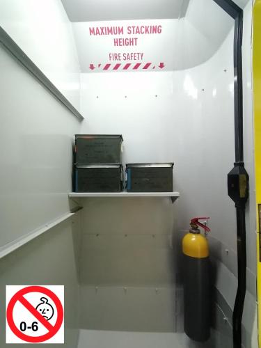 a stairway with shelves and a fire extinguisher at Le Making Of Chambres d'Hôtes insolites et Familiales in Thairé