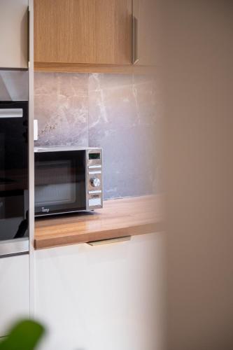 Kuchyň nebo kuchyňský kout v ubytování Num Suites & Lofts Athens