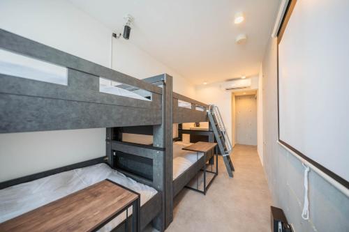 a group of bunk beds in a room at Minn Haneda Airport in Tokyo