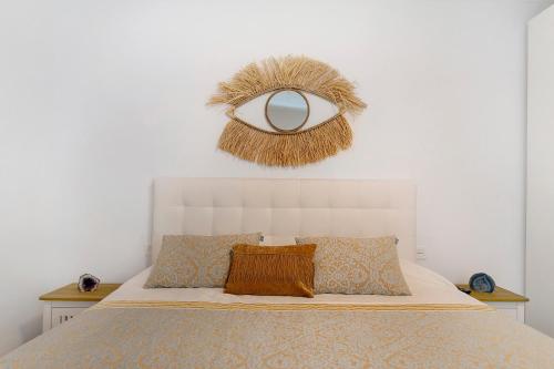 a bedroom with a bed and a mirror on the wall at El Pasero in El Golfo