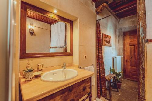 a bathroom with a sink and a mirror at Kale Konak Cappadocia in Uchisar
