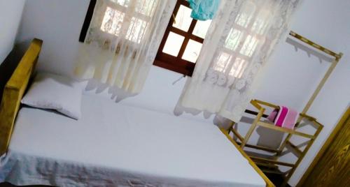 En eller flere senger på et rom på Sinharaja Greenvilla Homestay