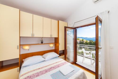 Postel nebo postele na pokoji v ubytování Apartments Palmero