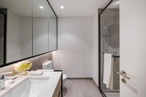a bathroom with a sink and a shower at Elegant Brand New Studio Wilton Park Residence MBR in Dubai