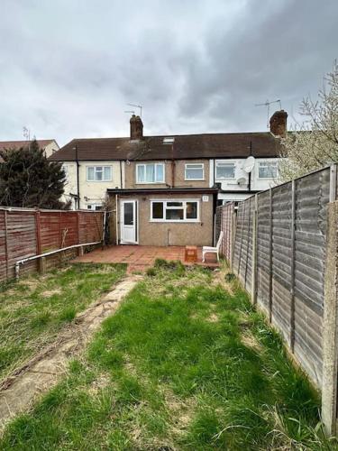a house with a fence in front of it at 30 min STN or to central London in Enfield Lock