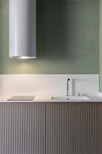a bathroom with a sink and a green wall at PALAZZO CIOPETA - Italian Excellence in Verona