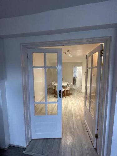 a door leading into a dining room with a table at 30 min STN or to central London in Enfield Lock