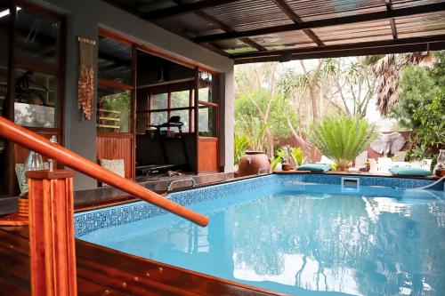 a swimming pool in a house at Havana Nights in Graskop