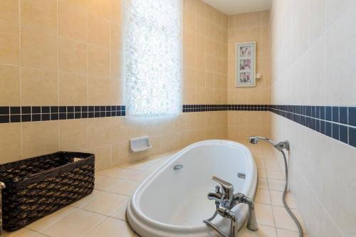 a bathroom with a tub and a sink at Duplex Condominium In Bukit Bintang For Rent in Kuala Lumpur