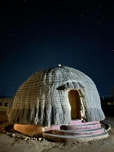 a small igloo in the snow at night at Swazi Dreams. (Nqabaneni Eco-Volunteering.) in Usutu